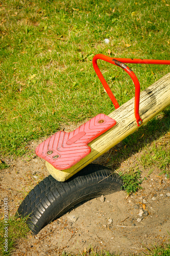 Fotografie POZNAN, POLAND - Jul 18, 2017: Seesaw and Dunlop tire in the ground