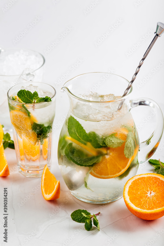 Side view on lemonade in a jug and glass Side view on lemonade in a jug and glass
