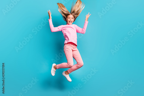 Full size photo of funky cool teenager jump yell hair up wear pink pants poloneck white footwear isolated on teal background