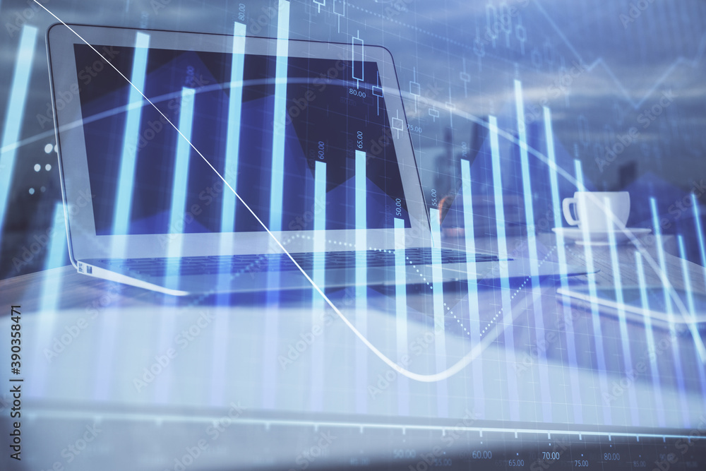 Forex Chart hologram on table with computer background. Double exposure. Concept of financial markets. Forex Chart hologram on table with computer background. Double exposure. Concept of financial markets.