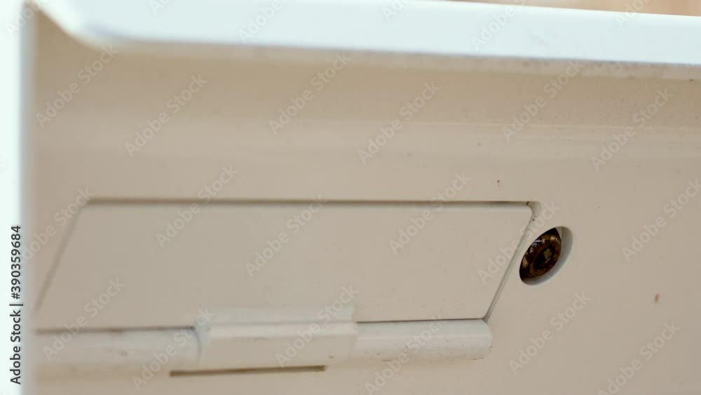 White Mail Slot for Letters With Lock Close Up White Mail Slot for Letters With Lock Close Up