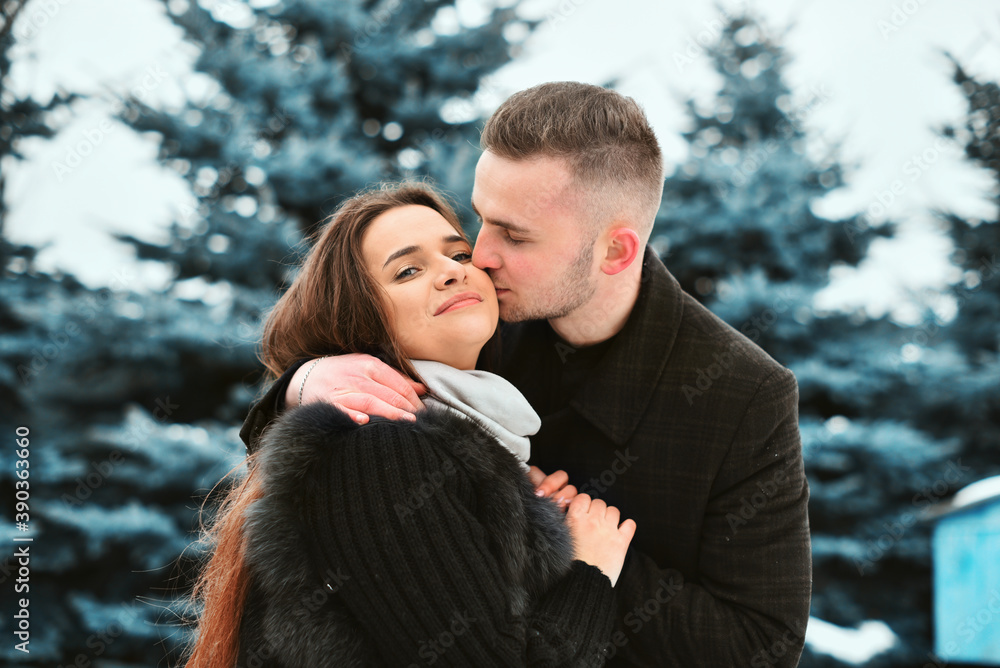 Winter love story. smile, hugs and kiss of a couple in love. romance and love Winter love story. smile, hugs and kiss of a couple in love. romance and love