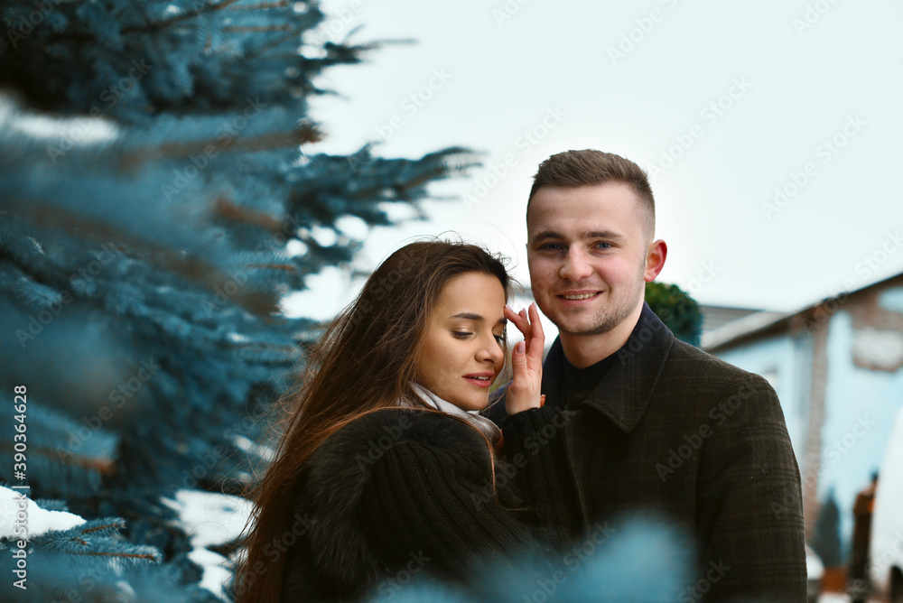 hugs and a kiss of a couple in love. Winter love story. romance and love hugs and a kiss of a couple in love. Winter love story. romance and love