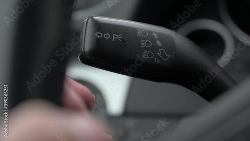 4K video of a driver's hand moving the control to set the blinking lights on
