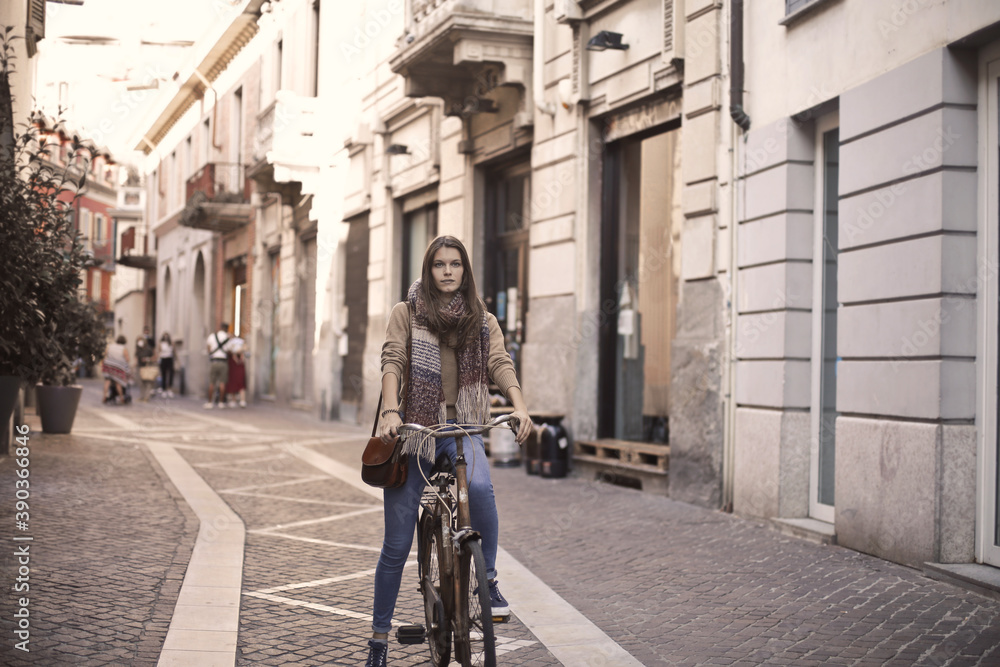 young woman cycling in the city young woman cycling in the city