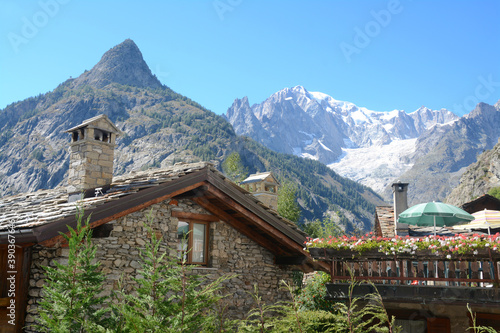 Alpine panorama in Courmayeur in the Aosta Valley with the Mont Blanc massif and glacier and the Mont Chetif peak. photo