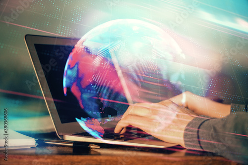 Cuadro en lienzo Technology theme hologram with man working on computer on background