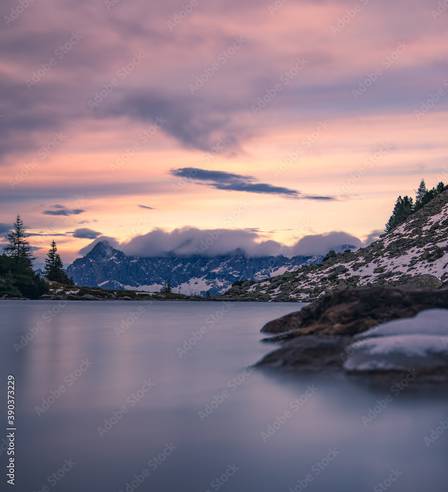 sunset over the lake in the austrian alps at the dachstein region in styria, austria with a beautiful view of the alps 