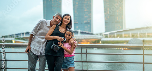 Happy caucasian family visiting modern city