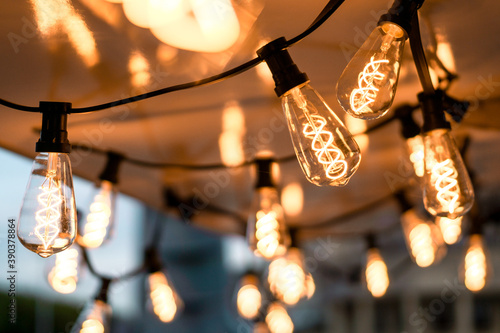 garland of incandescent lamps with blurred background. background, wallpaper