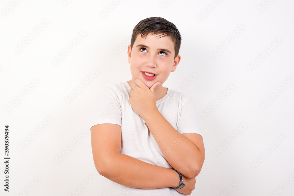 Caucasian young boy standing against white background smiling friendly offering something with open hand or handshake as greeting and welcoming. Successful business. Caucasian young boy standing against white background smiling friendly offering something with open hand or handshake as greeting and welcoming. Successful business.