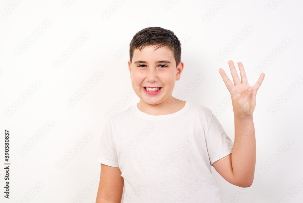 Caucasian young boy standing against white background showing and pointing up with fingers number four while smiling confident and happy. Caucasian young boy standing against white background showing and pointing up with fingers number four while smiling confident and happy.
