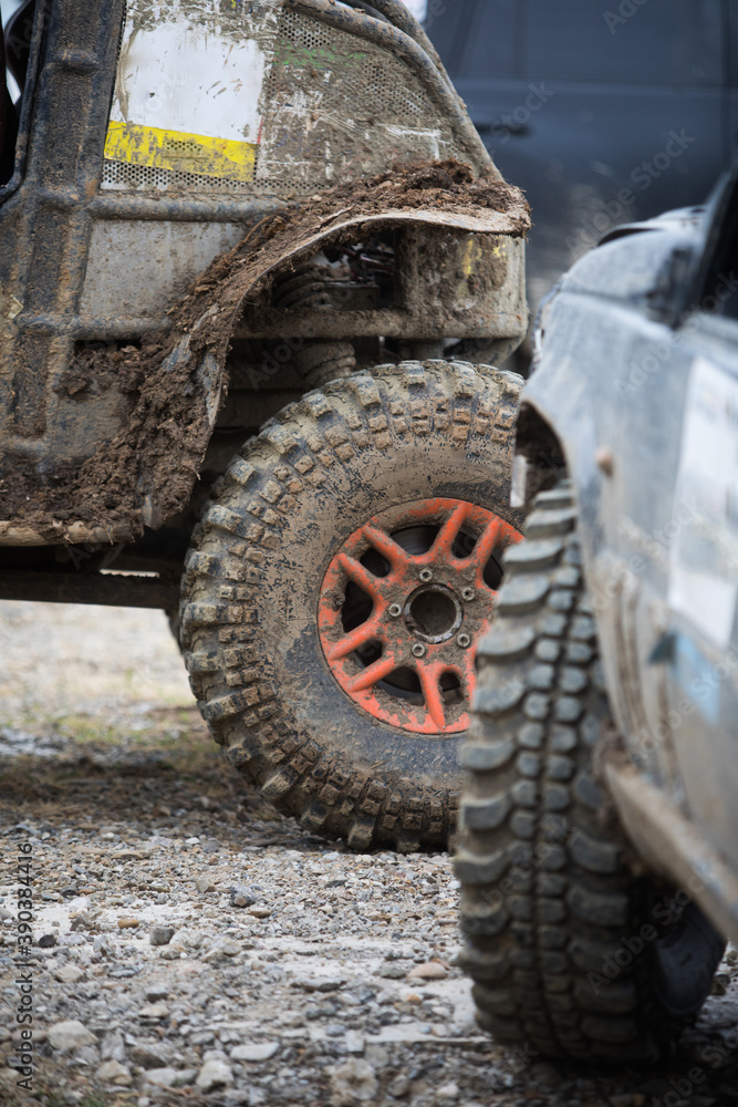 Muddy off road tire on a 4x4 car Muddy off road tire on a 4x4 car