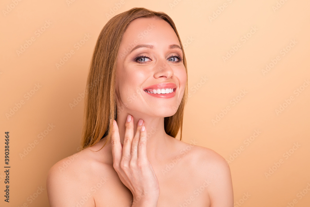 Close-up portrait of her she nice attractive lovely cheerful confident straight-haired girl applying moisturizing nourishing effective detox sculpturing cream concept isolated over beige background Close-up portrait of her she nice attractive lovely cheerful confident straight-haired girl applying moisturizing nourishing effective detox sculpturing cream concept isolated over beige background
