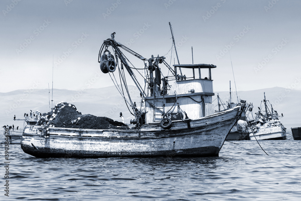 fishing boat in bay, moored fishing boat in bay, moored