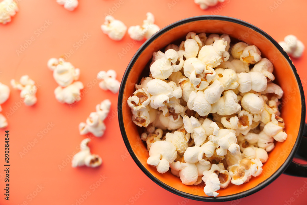 popcorn in a bowl on orange background top view popcorn in a bowl on orange background top view