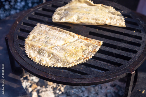 Appetizing traditional uzbek pies cooking outdoors photo