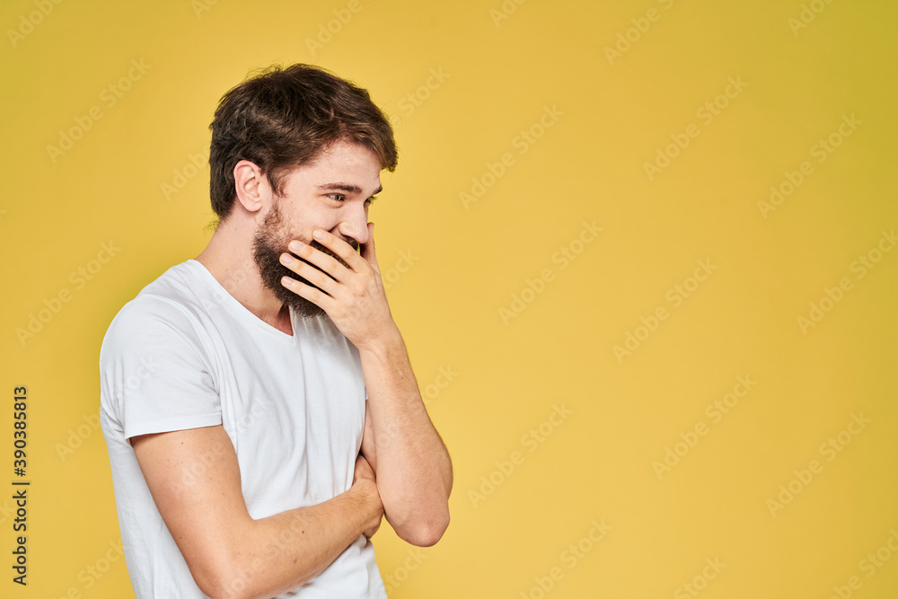 Bearded man white t-shirt emotions gestures with hands fun yellow background Bearded man white t-shirt emotions gestures with hands fun yellow background