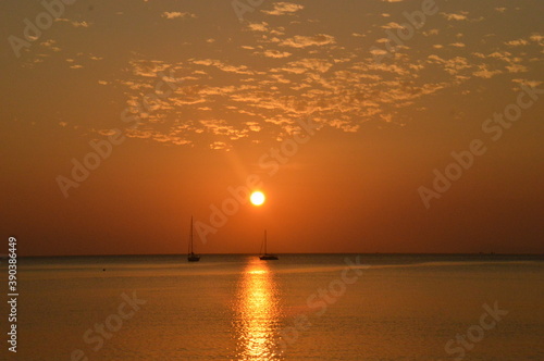 Sunset on the beaches of the untouced island of Ko Phayam in the Andaman Sea, Thailand photo