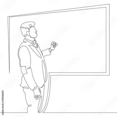 Scientist professor teacher stands writes on the student board