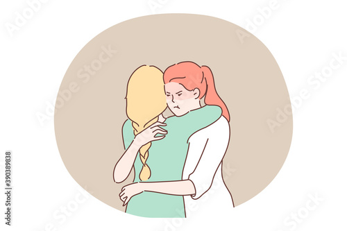 Jealousy, envy, hypocrisy concept. Envious jealous woman with dissatisfied angry facial expression embracing friend thinking about deceit. Distrust deception between close relatives false friendhip