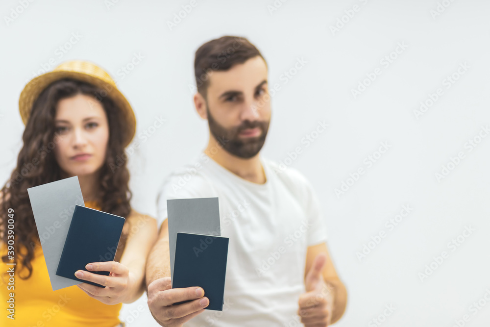 Young woman and husband holding passports as trip document with interesting look. Young woman and husband holding passports as trip document with interesting look.