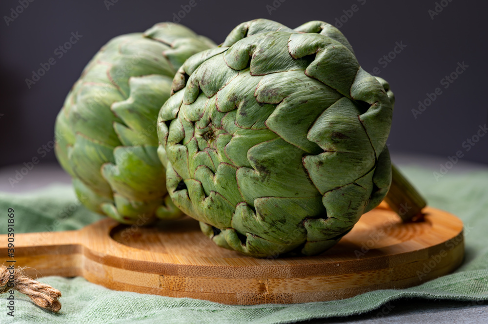 Big ripe uncooked green globe artichoks vegetables Big ripe uncooked green globe artichoks vegetables