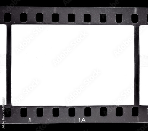 real scan of black and white 35mm film, empty or blank film frame on black, nice photo placeholder for your poster idea.