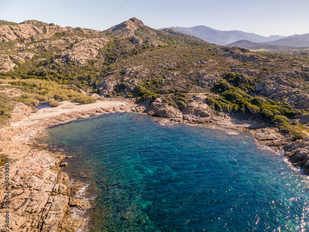 Rocky coastline and small sandy beach near Ostriconi in Corsica
