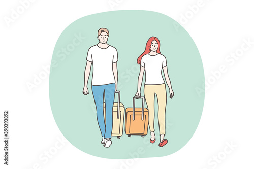 Holiday, travelling, tourism concept. Couple man woman boyfriend girlfriend travelers tourists walk with baggage luggage together. Travel abroad on vacation adventure lifestyle summertime recreation.