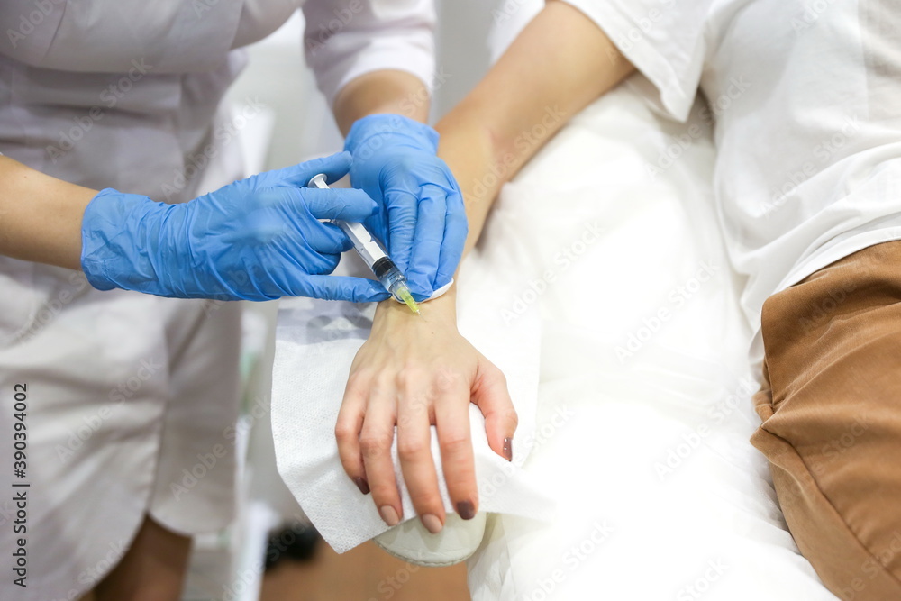 procedure of injections of vitamins in the hands. rejuvenation of the skin of the hands. care of the skin of the hands with vitamins procedure of injections of vitamins in the hands. rejuvenation of the skin of the hands. care of the skin of the hands with vitamins