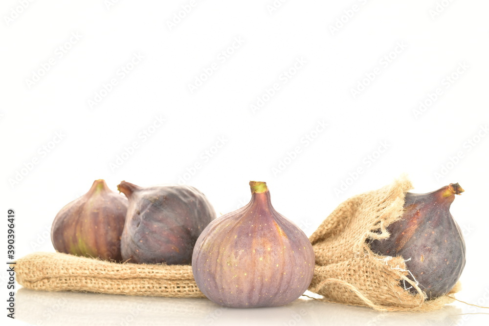 Fototapeta premium Ripe dark blue organic figs, close-up, on a white background.