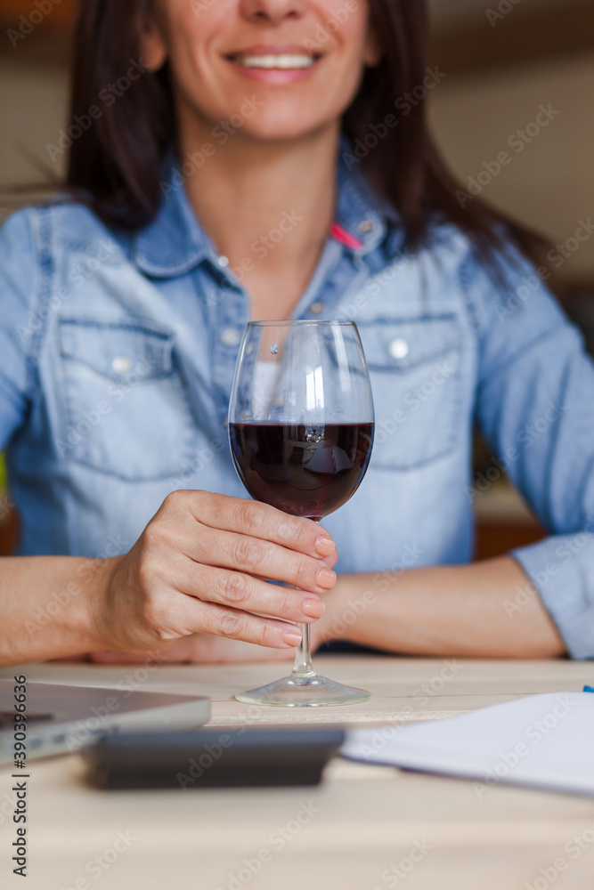 Close up of unrecognizable woman with a glass of wine. Close up of unrecognizable woman with a glass of wine.
