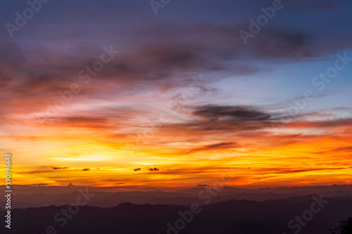 Beautiful Sunset and sunrise on sky and golden twilight time  in valley of mountain layer © pong0402
