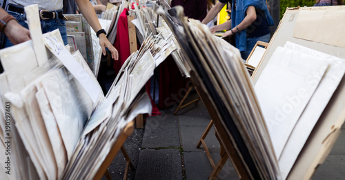 People looking into old maps and posters
