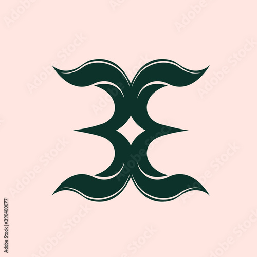 EE monogram leaf logo.Nature elements typographic icon.Alphabet initial for beauty, health care, ecological lifestyle brand.Lettering sign.Character green plant shape isolated on light pink fund.