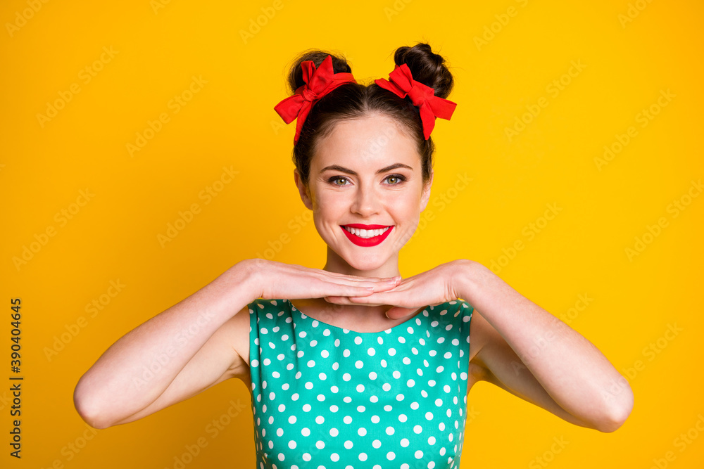 Close-up portrait of pretty cheerful girl showing good bright makeover isolated over vibrant yellow color background Close-up portrait of pretty cheerful girl showing good bright makeover isolated over vibrant yellow color background
