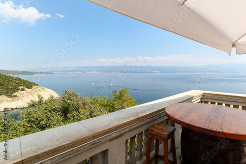 View from island Krk with rocky coastline and pine tree to dalmatian coast near Rijeka on Adriatic sea  Croatia Europe