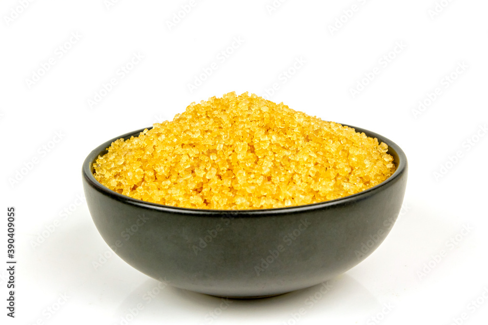 Sugar from sugarcane in black bowl isolated on white background. Sugar from sugarcane in black bowl isolated on white background.