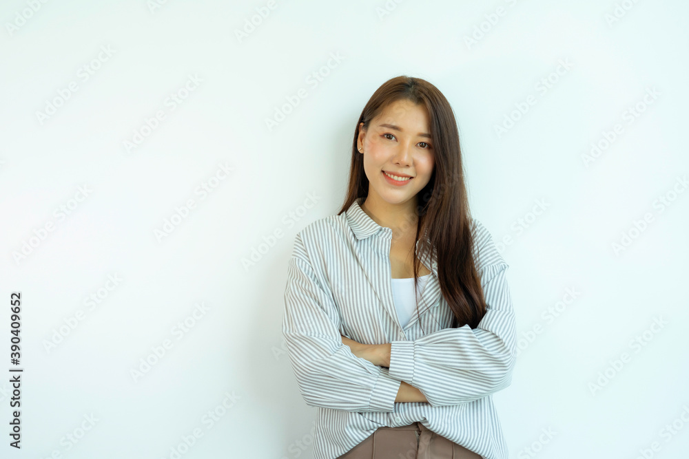 Asian woman wearing striped white shirt Smiling pretty, standing with arms crossed On a white background. Asian woman wearing striped white shirt Smiling pretty, standing with arms crossed On a white background.