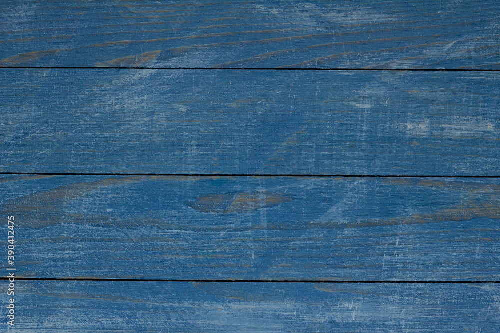 Vintage blue wood background texture with knots and nail holes. Old painted wood wall. Blue abstract background. Vintage wooden dark blue horizontal boards. Front view with copy space