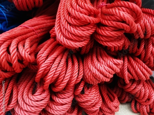 pile of a red plastic rope in the stores.