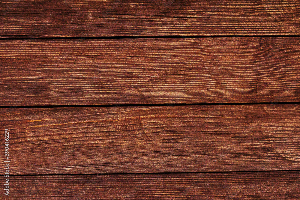 Fototapeta premium Vintage brown wood background texture with knots and nail holes. Old painted wood wall. Brown abstract background. Vintage wooden dark horizontal boards. Front view with copy space