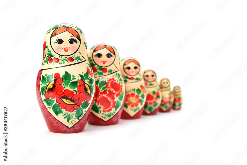 A set of nesting dolls lined up, the back ones are slightly blurred to show the depth of the image