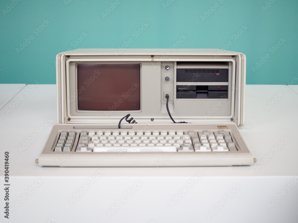 Foto Stock TERRASSA, SPAIN-AUGUST 9, 2020: 1984 IBM Portable PC Computer  5155 model 68 in the National Museum of Science and Technology of Catalonia  | Adobe Stock