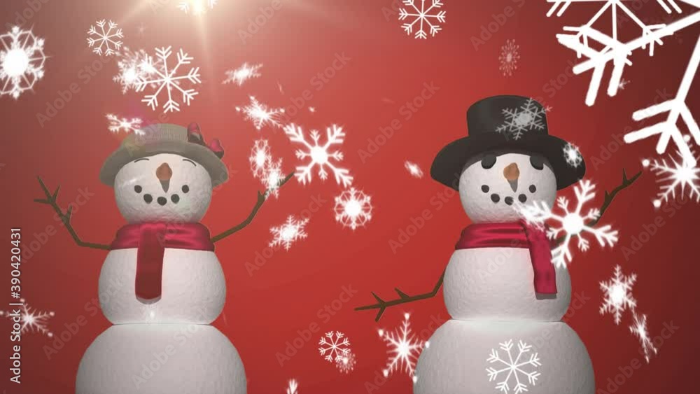 Digital animation of snow flakes falling over male and female snowman Digital animation of snow flakes falling over male and female snowman