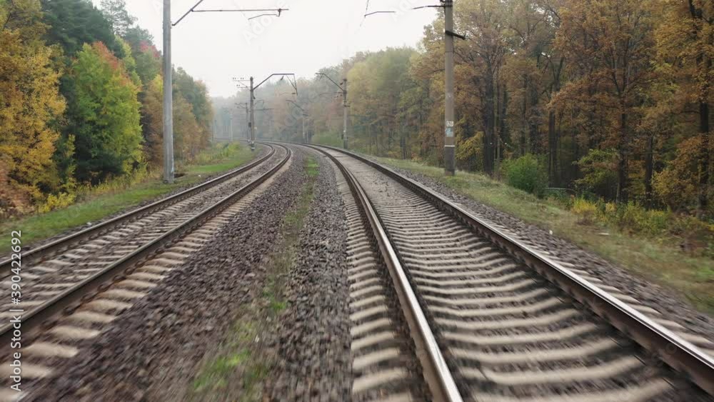 Drone flying along the railroad tracks in autumn forest. Drone flying along the railroad tracks in autumn forest.