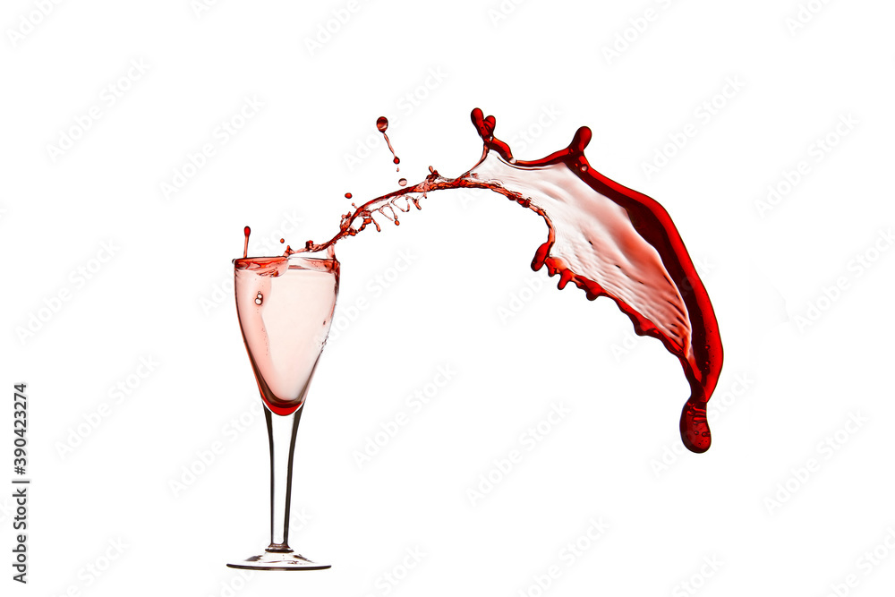Splash in a glass of red wine . splashes of wine from a glass on a white background Splash in a glass of red wine . splashes of wine from a glass on a white background