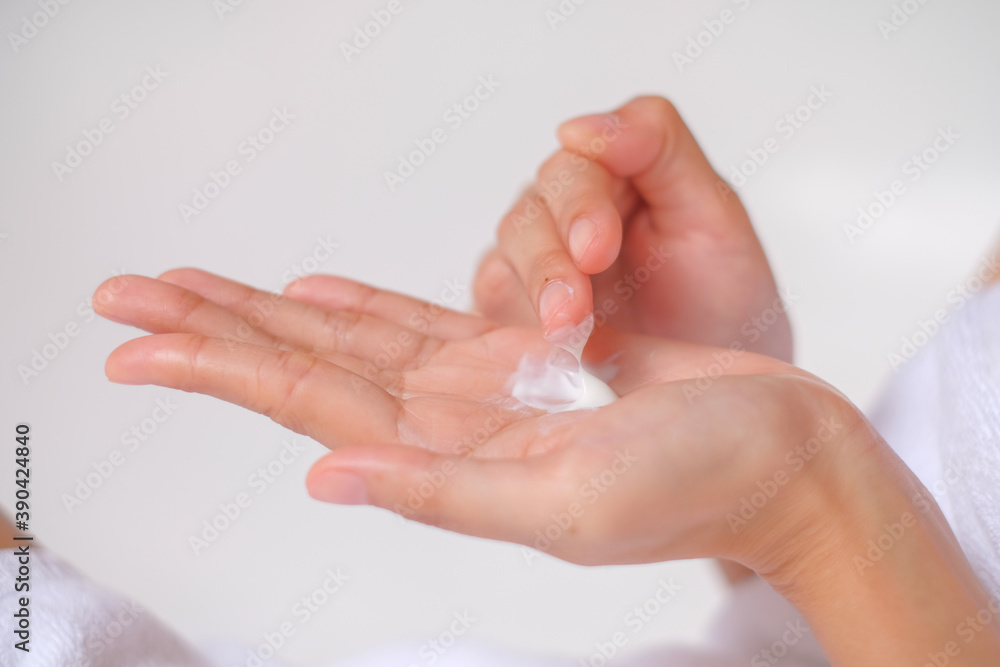 Woman applying cream,lotion on hand with white background, Beauty concept. Woman applying cream,lotion on hand with white background, Beauty concept.