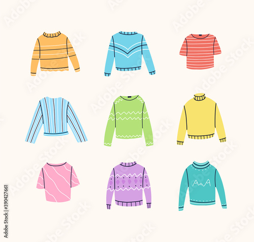 Set of different sweaters,  jumpers, t-shirts, blouses, turtlenecks. Stylish clothes with various decorations. Vector hand drawn illustration. 